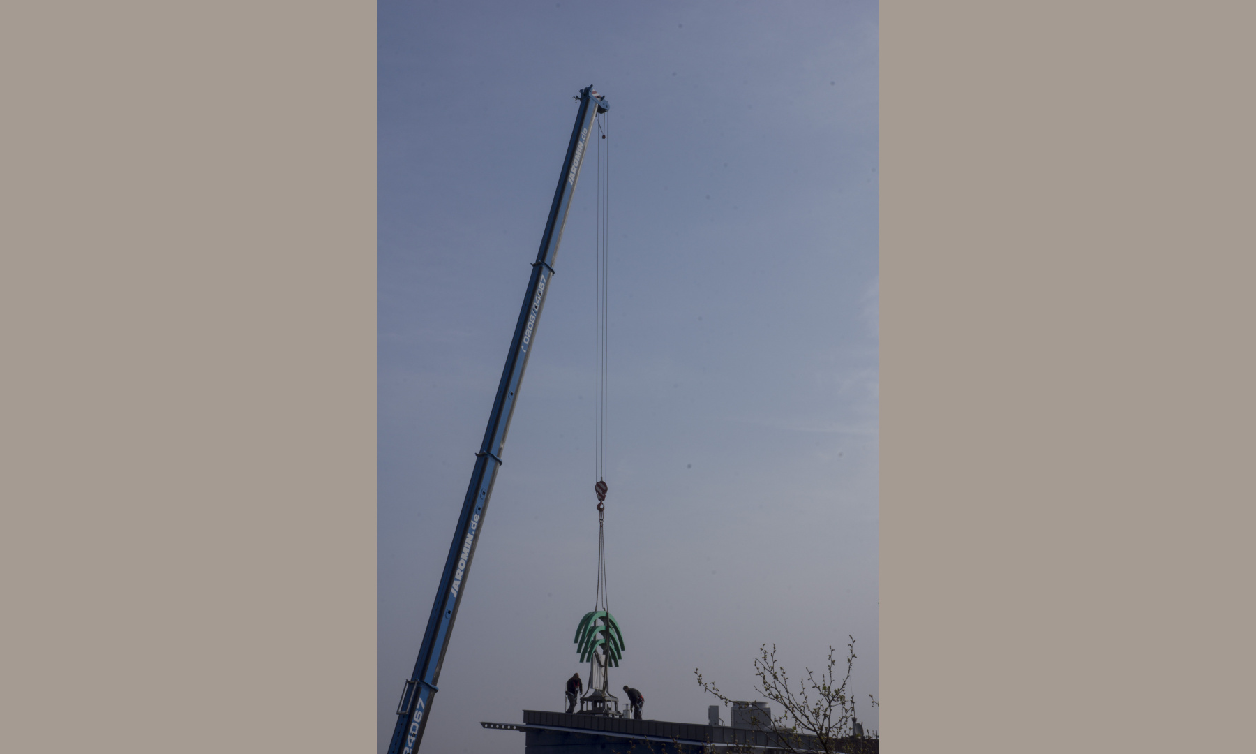 A crane taking down the N-symbol from the former Norris bank in Essen A crane taking down the N-symbol from the former Norris bank in Essen
