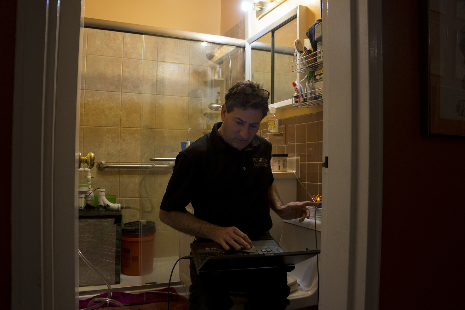 A professor checking his invention at the bath room A professor checking his invention at the bath room