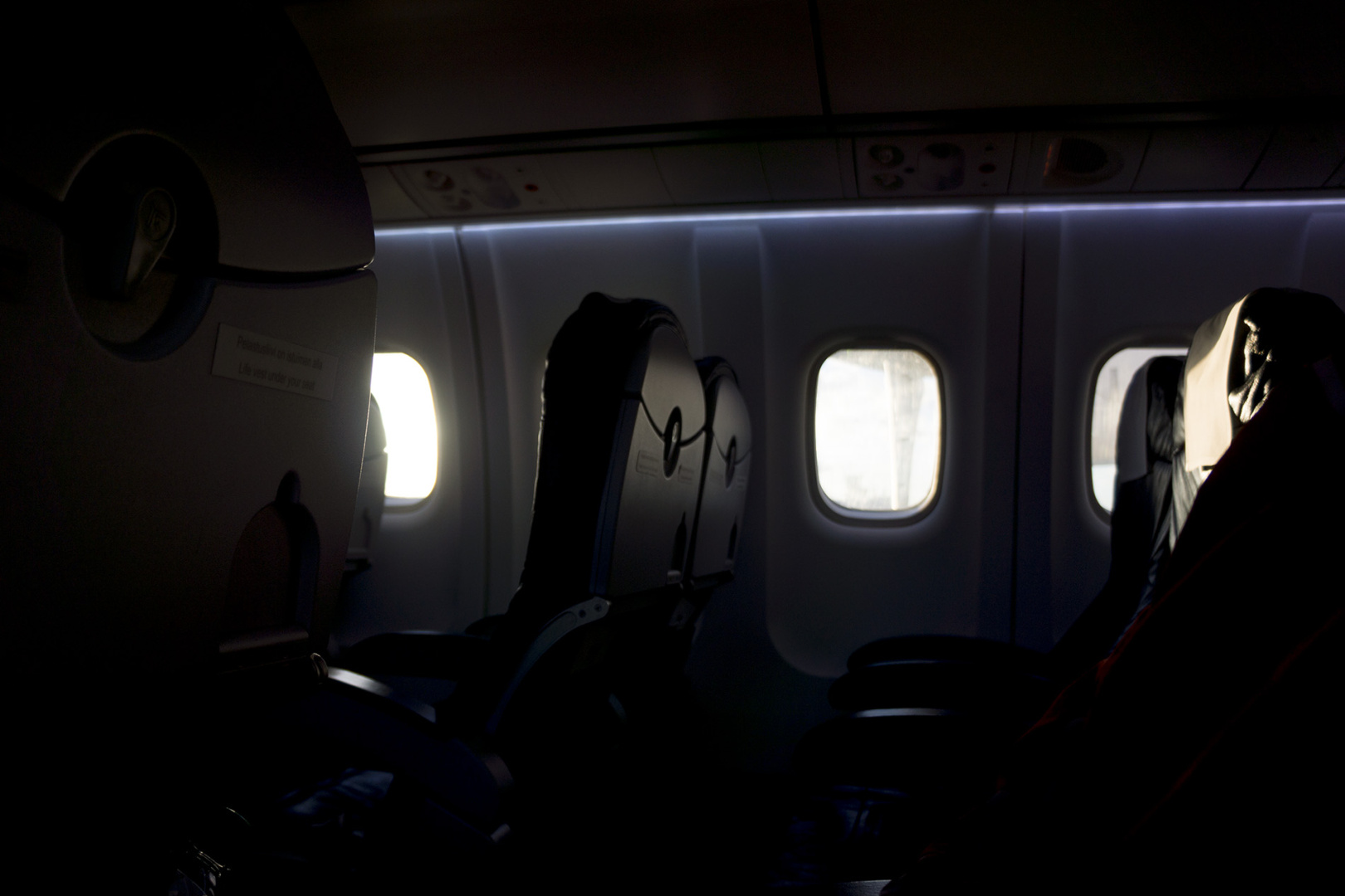 The seats at a nearly empty plane in the sky of Finland The seats at a nearly empty plane in the sky of Finland