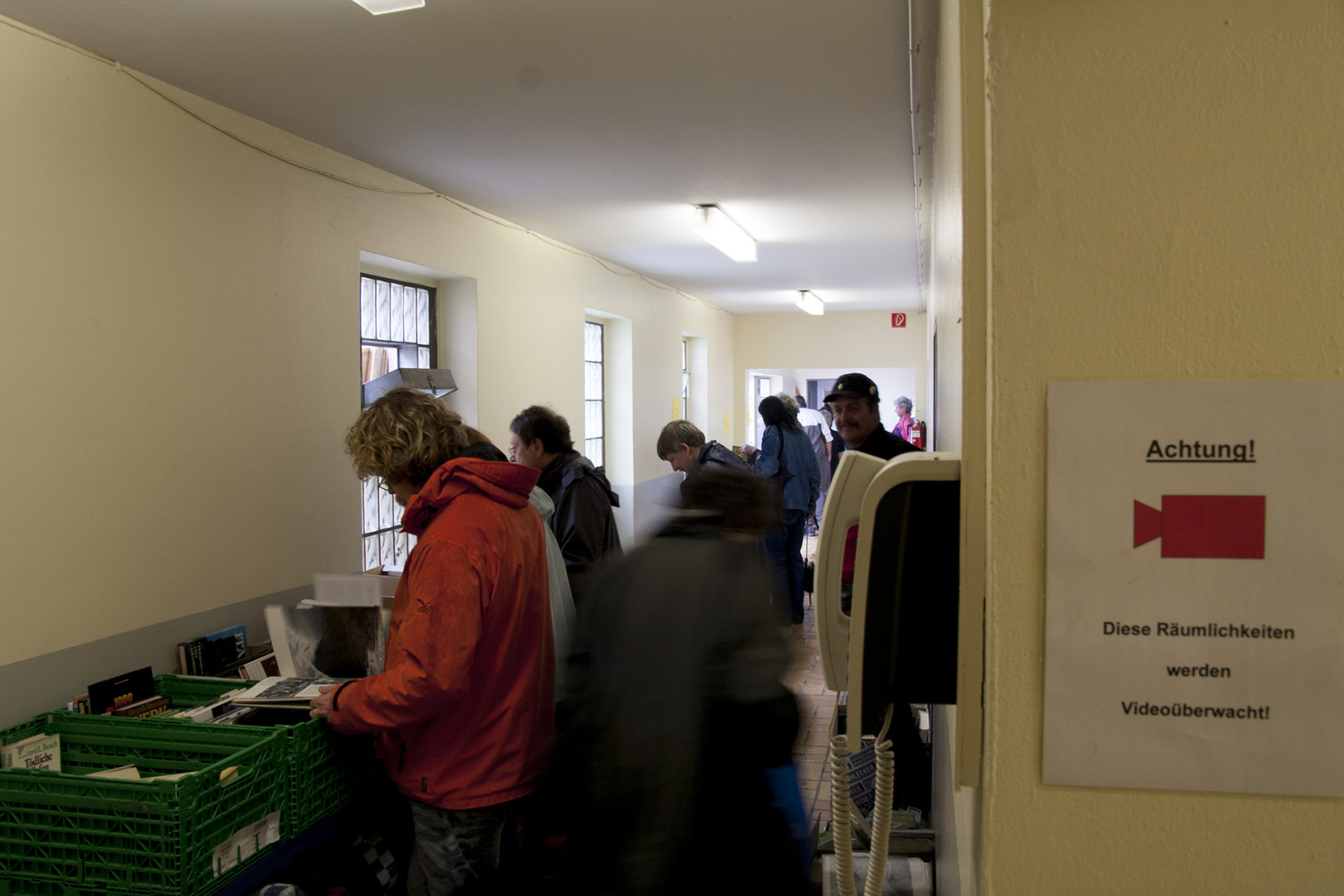 People looking for books at the book thrift of the animal shelter in Essen, Germany People looking for books at the book thrift of the animal shelter in Essen, Germany