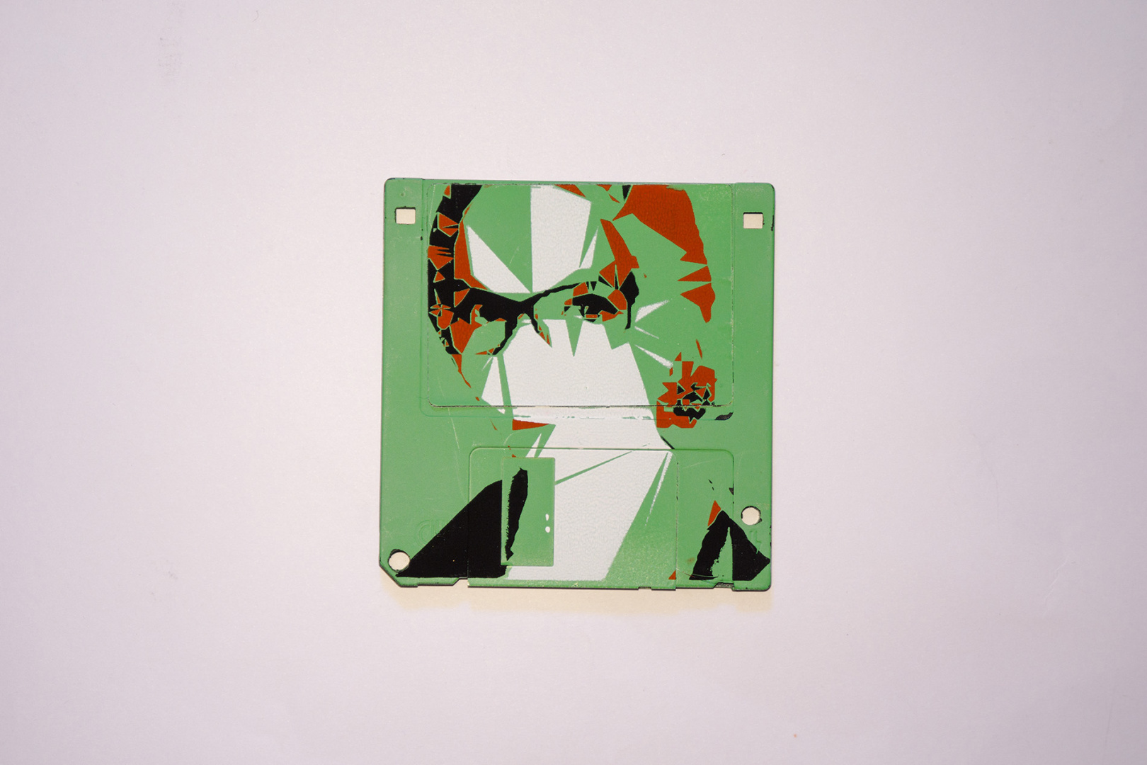 Serigraphy / Silkscreen of Milja on a 3.5" floppy disk. Contemporary artwork. Green version