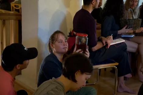 Student checking a glas of fermented pine needles