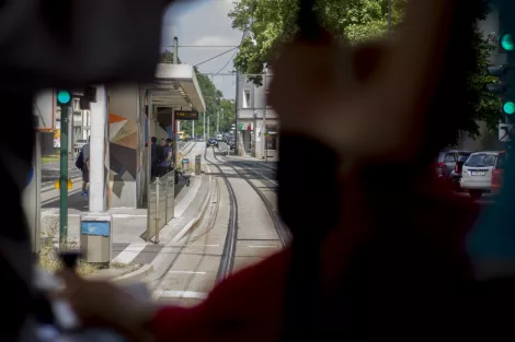 View from inside a tram behind the driver looking towards the station Zeche Zollverein