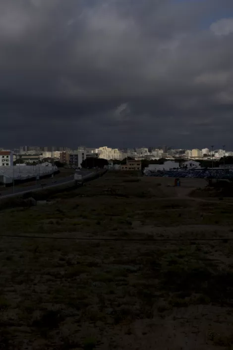 Sunlight during a storm at the city of Faro, Portugal