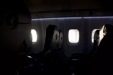 The seats at a nearly empty plane in the sky of Finland