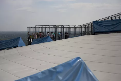 People in a cage at the top of the Gasometer in Oberhausen